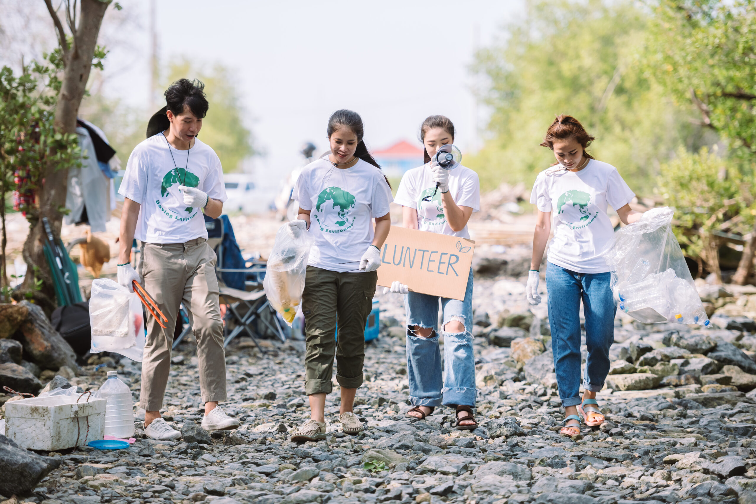 Group of asian diverse people volunteer teamwork ,environment conservation,volunteer help to picking plastic and foam garbage on park area.Volunteering world environment day.